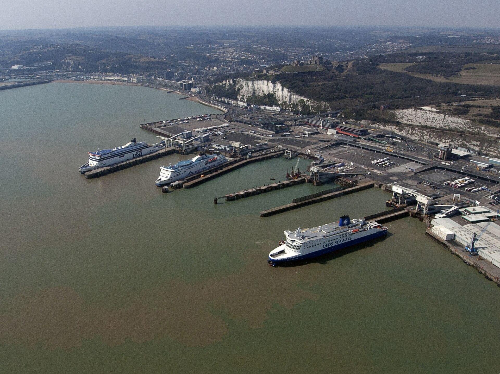 The Port of Dover from the air, ferries at the berths below the white cliffs